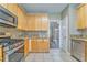 Open kitchen view featuring granite countertops, stainless appliances, and natural lighting at 1016 E Bay Springs Dr, Villa Rica, GA 30180