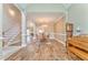 Open-concept living space with elegant wood floors, a fireplace, and ample natural light at 1016 E Bay Springs Dr, Villa Rica, GA 30180