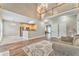 Spacious living room with wood floors opens to kitchen and second-floor balcony at 1016 E Bay Springs Dr, Villa Rica, GA 30180