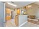 Open kitchen area with island into vaulted great room with a fireplace at 1016 E Bay Springs Dr, Villa Rica, GA 30180