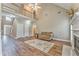 Spacious living room with fireplace, hardwood floors, balcony, and open floor plan at 1016 E Bay Springs Dr, Villa Rica, GA 30180