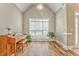 Open living area featuring wood floors, large windows and plant accents at 1016 E Bay Springs Dr, Villa Rica, GA 30180