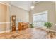 Bright living room featuring wood floors, high ceilings, a large window and lots of natural light at 1016 E Bay Springs Dr, Villa Rica, GA 30180