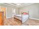 Relaxing main bedroom with en-suite bathroom access, trey ceilings and hardwood floors at 1016 E Bay Springs Dr, Villa Rica, GA 30180