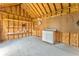 Interior shed view features shelving and peg board for extra organized storage with wooden walls and bright gray concrete floors at 1016 E Bay Springs Dr, Villa Rica, GA 30180