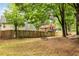 Expansive backyard enclosed by a wooden fence, offering ample space for outdoor activities at 1359 Cedar Park Pl, Stone Mountain, GA 30083
