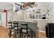 Home bar area with seating and shelving for beverage storage at 1359 Cedar Park Pl, Stone Mountain, GA 30083