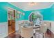 Bright dining room featuring a large window, stylish decor, and comfortable seating for six at 1359 Cedar Park Pl, Stone Mountain, GA 30083