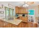 Well-equipped kitchen featuring granite countertops, wood cabinets, and stainless steel appliances at 1359 Cedar Park Pl, Stone Mountain, GA 30083