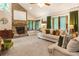 Cozy living room with a stone fireplace, large windows, plush seating, and ample natural light at 1359 Cedar Park Pl, Stone Mountain, GA 30083