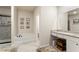 Modern bathroom with a separate tub, glass-enclosed shower, and neutral color palette at 426 Samara Ct, Fairburn, GA 30213