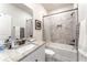 Bright bathroom featuring granite counters, a tub with tile surround, and bronze hardware at 426 Samara Ct, Fairburn, GA 30213