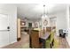 Inviting dining room features modern decor, wood floors, and bright natural light at 426 Samara Ct, Fairburn, GA 30213