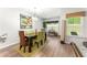 Cozy dining room featuring modern lighting, stylish decor, and views of outdoors at 426 Samara Ct, Fairburn, GA 30213