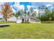 Well-maintained single-story home with green lawn, attractive landscaping, and an attached two-car garage at 426 Samara Ct, Fairburn, GA 30213