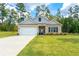 Charming single-story home with a well-maintained lawn, brick accents, and a welcoming front entrance at 426 Samara Ct, Fairburn, GA 30213