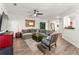 Spacious living room with wooden floors, neutral furniture, and a decorative mirror at 426 Samara Ct, Fairburn, GA 30213
