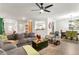 Comfortable living room with a gray sectional sofa, modern decor, and an open layout at 426 Samara Ct, Fairburn, GA 30213