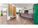 Open-concept living space showcasing hardwood floors, neutral decor, and seamless flow into the dining and kitchen areas at 426 Samara Ct, Fairburn, GA 30213