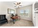 Neutral office with a ceiling fan, desk, chair, and window with outside view at 426 Samara Ct, Fairburn, GA 30213
