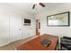 Office with a map on the wall and a dark wood desk with chair at 426 Samara Ct, Fairburn, GA 30213