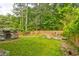 Spacious backyard featuring a lawn and mature trees, perfect for outdoor entertaining at 569 Woods Nw Dr, Atlanta, GA 30318