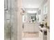 Bathroom featuring double vanity, large mirror, and modern fixtures at 569 Woods Nw Dr, Atlanta, GA 30318