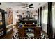Spacious bedroom with eclectic decor, large windows, and hardwood floors at 569 Woods Nw Dr, Atlanta, GA 30318