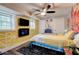 Bedroom featuring graffiti art, modern lighting, and a wall-mounted fireplace at 569 Woods Nw Dr, Atlanta, GA 30318
