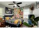 Modern bedroom featuring colorful graffiti art and a sleek ceiling fan at 569 Woods Nw Dr, Atlanta, GA 30318