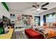Bedroom with vibrant graffiti art wall, featuring modern decor and a ceiling fan at 569 Woods Nw Dr, Atlanta, GA 30318