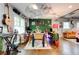 Eclectic dining room with unique ceiling and wall decor and hardwood floors at 569 Woods Nw Dr, Atlanta, GA 30318