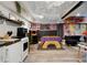 Recreation room featuring a dart board, a kitchenette, and a foosball table at 569 Woods Nw Dr, Atlanta, GA 30318