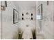 Modern shower with glass door, neutral tile, and rain shower head at 569 Woods Nw Dr, Atlanta, GA 30318