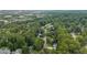Aerial view of a lush, tree-filled neighborhood with well-maintained homes, offering a peaceful setting at 615 Barrington Way, Roswell, GA 30076