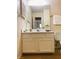 Bathroom with a single vanity, a large mirror, and a toilet on the right at 615 Barrington Way, Roswell, GA 30076