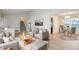 Inviting living room with modern furnishings and an adjacent dining area with plenty of natural light at 615 Barrington Way, Roswell, GA 30076