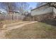 Stone retaining wall and walkway leading to the backyard with a landscaped hillside at 101 Terrace Dr, Atlanta, GA 30305