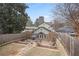 Well-kept backyard with stone patio, walkways and raised garden beds surrounded by a wooden fence at 101 Terrace Dr, Atlanta, GA 30305