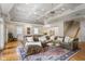 Spacious basement area featuring a coffered ceiling, hardwood floors, and a comfortable seating area at 101 Terrace Dr, Atlanta, GA 30305