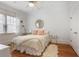 Bright bedroom with hardwood floors, large window, and white walls at 101 Terrace Dr, Atlanta, GA 30305