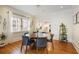 Elegant dining room with hardwood floors, modern lighting, and kitchen access at 101 Terrace Dr, Atlanta, GA 30305