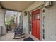 Inviting front porch with brickwork, rocking chairs, and a bright red front door at 101 Terrace Dr, Atlanta, GA 30305