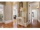 Entry hallway with hardwood floors leading to well-lit bedrooms and bath at 101 Terrace Dr, Atlanta, GA 30305