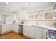 Well-lit kitchen with stainless steel appliances, white cabinets, and hardwood floors at 101 Terrace Dr, Atlanta, GA 30305