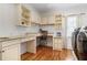Functional laundry room with counter space, storage cabinets, and washer and dryer hookups at 101 Terrace Dr, Atlanta, GA 30305