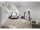 Bright and airy main bedroom with vaulted ceilings, a cozy sitting area, and French doors at 101 Terrace Dr, Atlanta, GA 30305