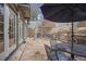 Stone patio featuring a stone wall, several seating areas, and an umbrella covered dining table at 101 Terrace Dr, Atlanta, GA 30305