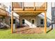 Backyard featuring brick construction, a wooden deck, and a grassy area at 2270 Siskin Square Rd # 91, Duluth, GA 30096