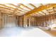 Unfinished basement with exposed framing, concrete floors, and ample space for customization at 2270 Siskin Square Rd # 91, Duluth, GA 30096